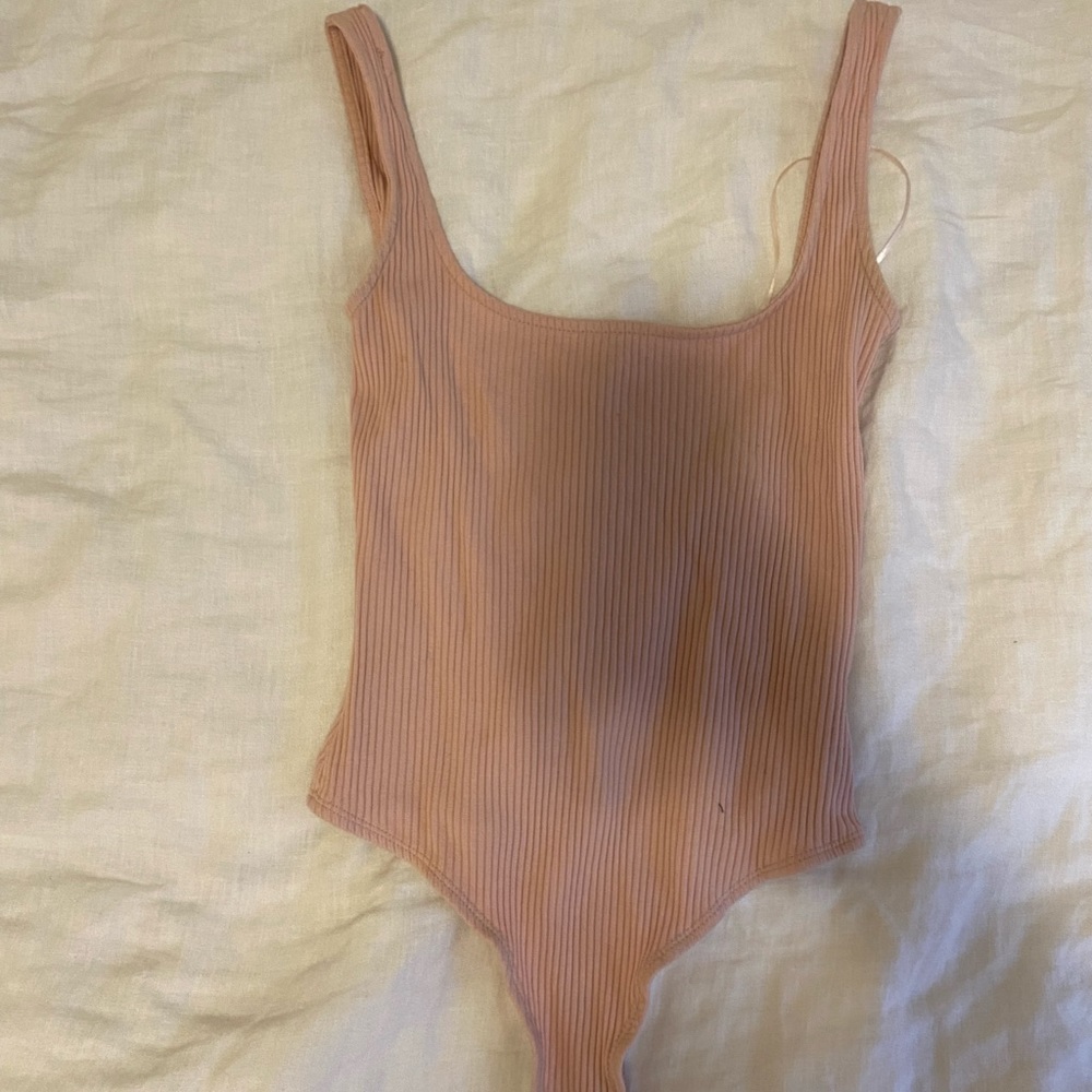 Light pink body suit. Size S. Worn once.